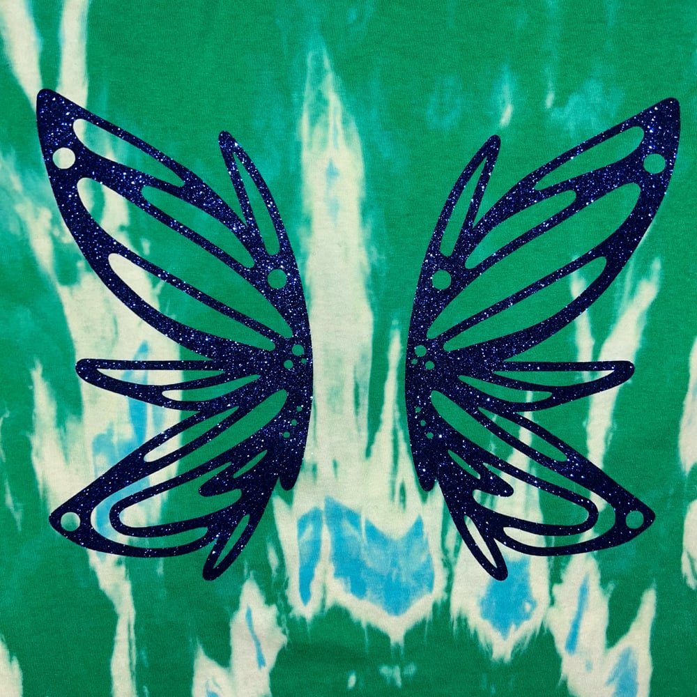 Image of green bleach dye tshirt with fairy wing design