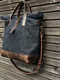 Image 3 of Black waxed canvas roll to close top tote bag with luggage handle attachment 