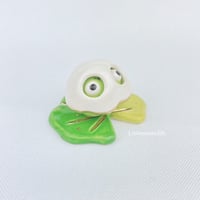 Image 4 of Sad zombie frog on lily pad with ghost mask ceramic figurine 