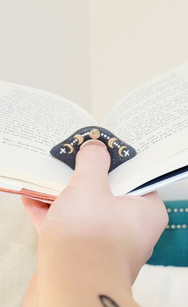 Image of Celestial Thumb Grip Page Holder