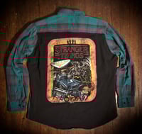 Upcycled “Stranger Things/Art” t-shirt flannel