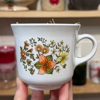 Image 1 of honeydew magnolia scented teacup candle