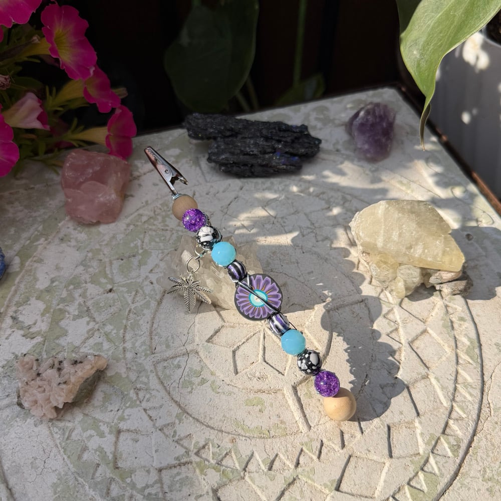 Image of twilight flower roach clip 