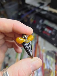 Image 3 of Orange opal/electrum glass shark tooth pendant. 