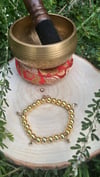 “Golden orbit” bracelet 
