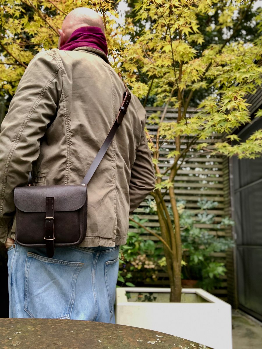 Image of Daybag in dark brown oiled leather with shoulder strap unisex collection