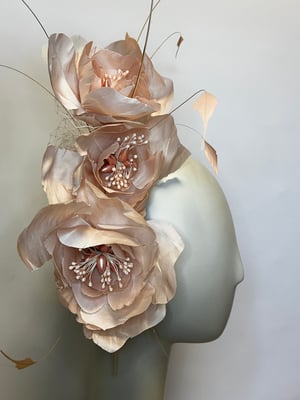 Image of Pale pink silk flower headpiece.