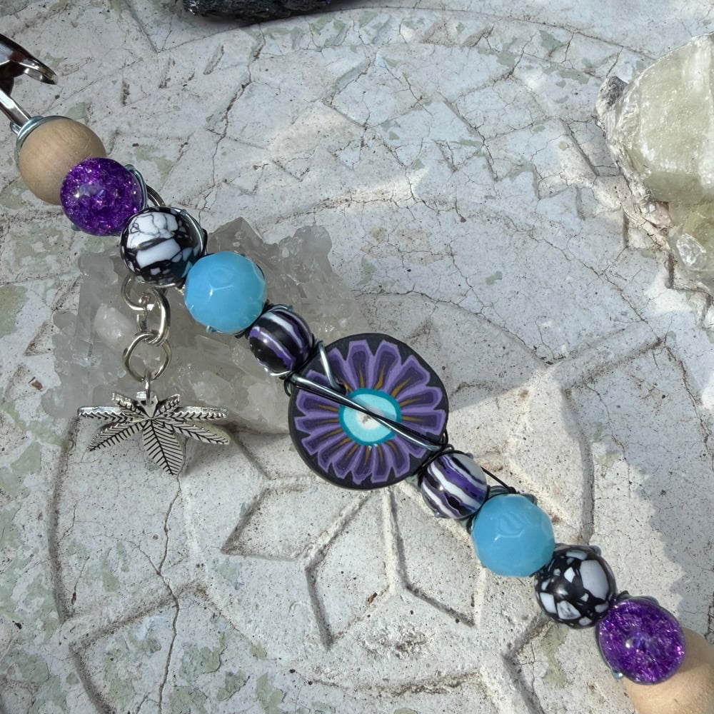 Image of twilight flower roach clip 