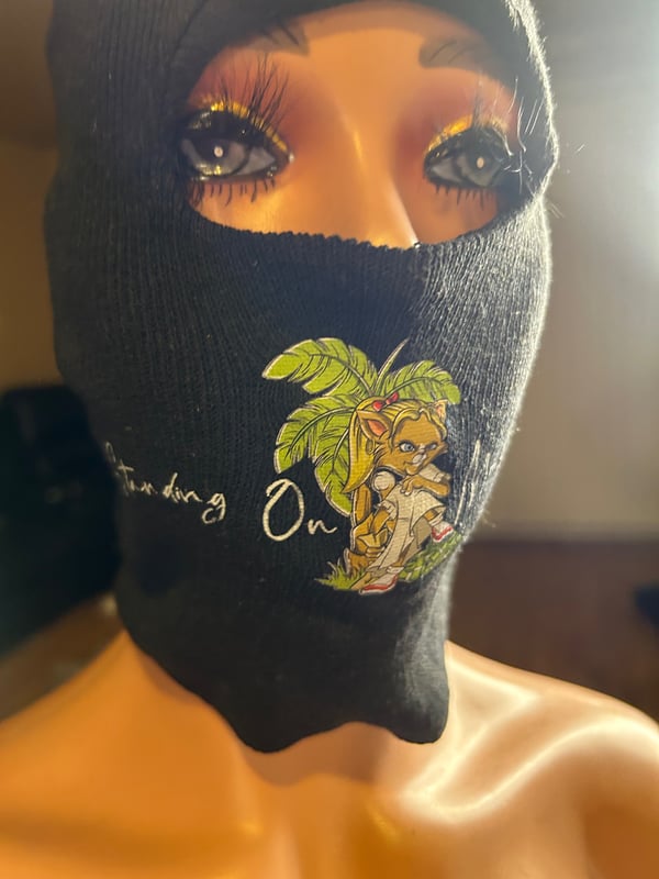 Image of Standing on money face mask 