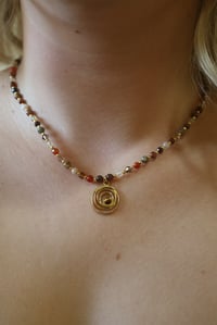 Image 1 of Brown Swirl (gold spacers)