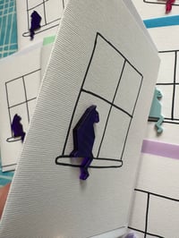 Image 3 of Cat Sitting In A Window