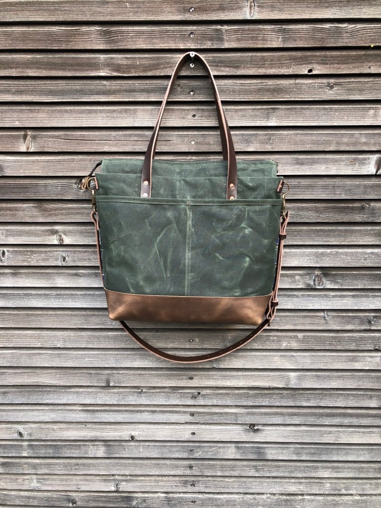 Image of  Waxed canvas carryall with handwoven exterior pocket in forest green