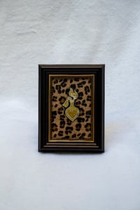 Image 2 of Molotovheart in gold with leo background
