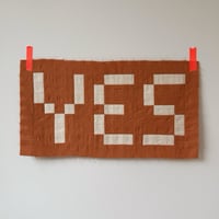 Image 1 of YES in sunset orange