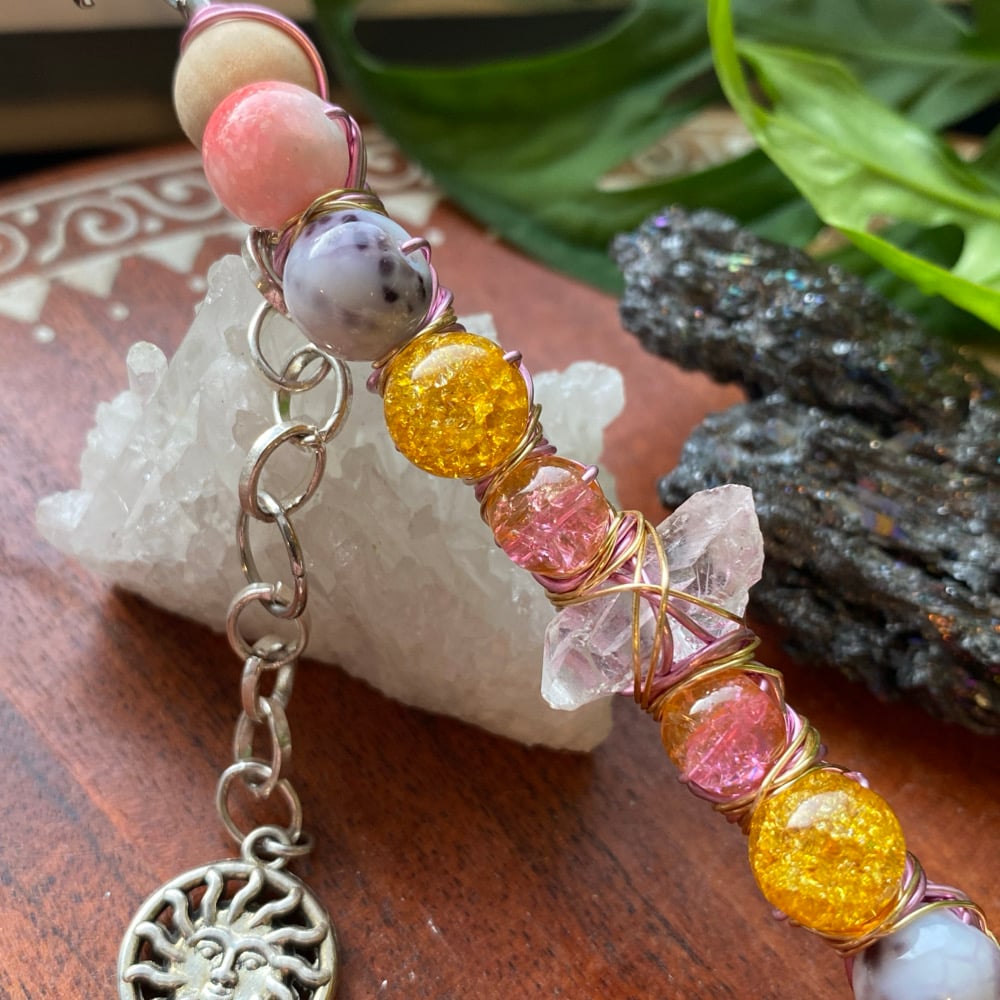 Image of strawberry sunset roach clip 