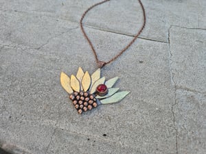 Sunflower pendant with ladybug 