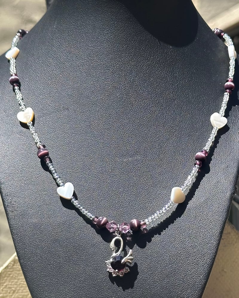 Image of purple swan necklace