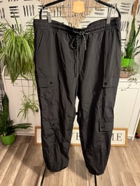 Image 1 of black drawstring parachute pants