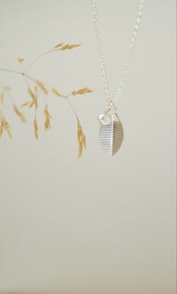Image 2 of Single-Leaf Silver Necklace with  striated texture  with Semi-Precious Pearl – Fold Collection