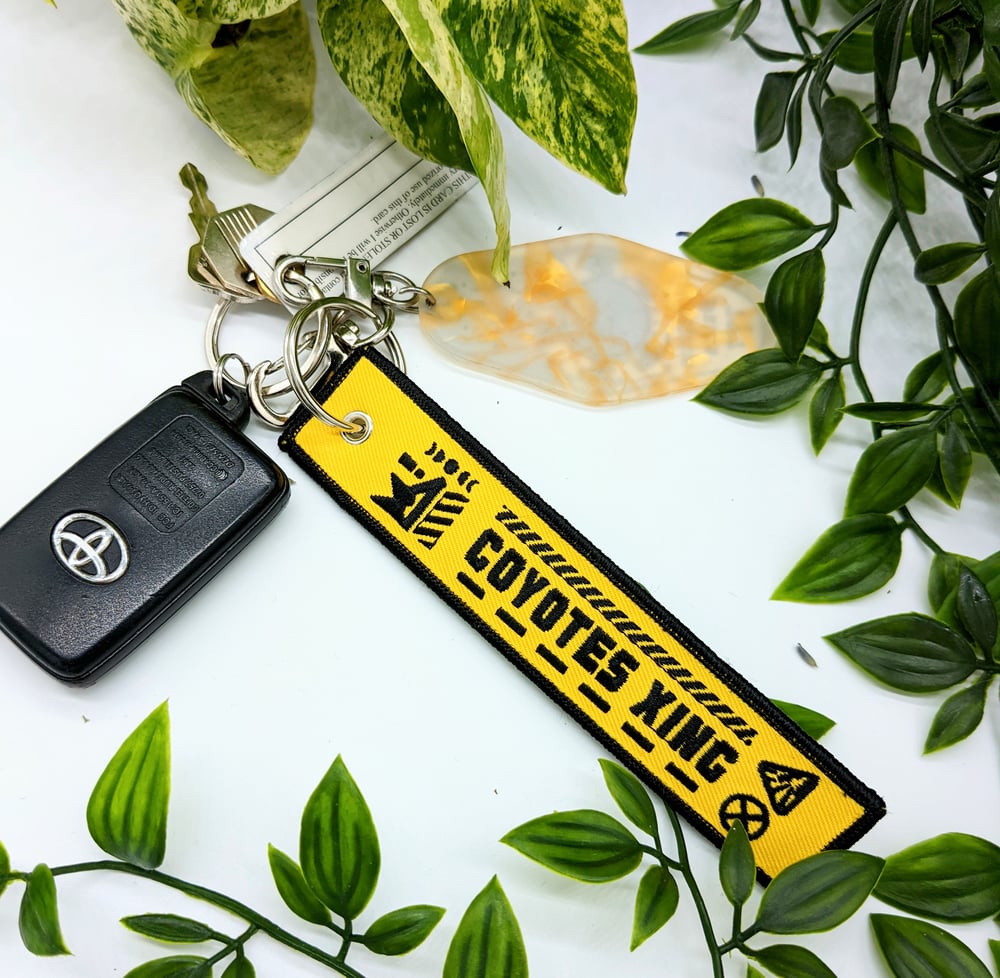 Image of COYOTES XING Embroidered Keychain