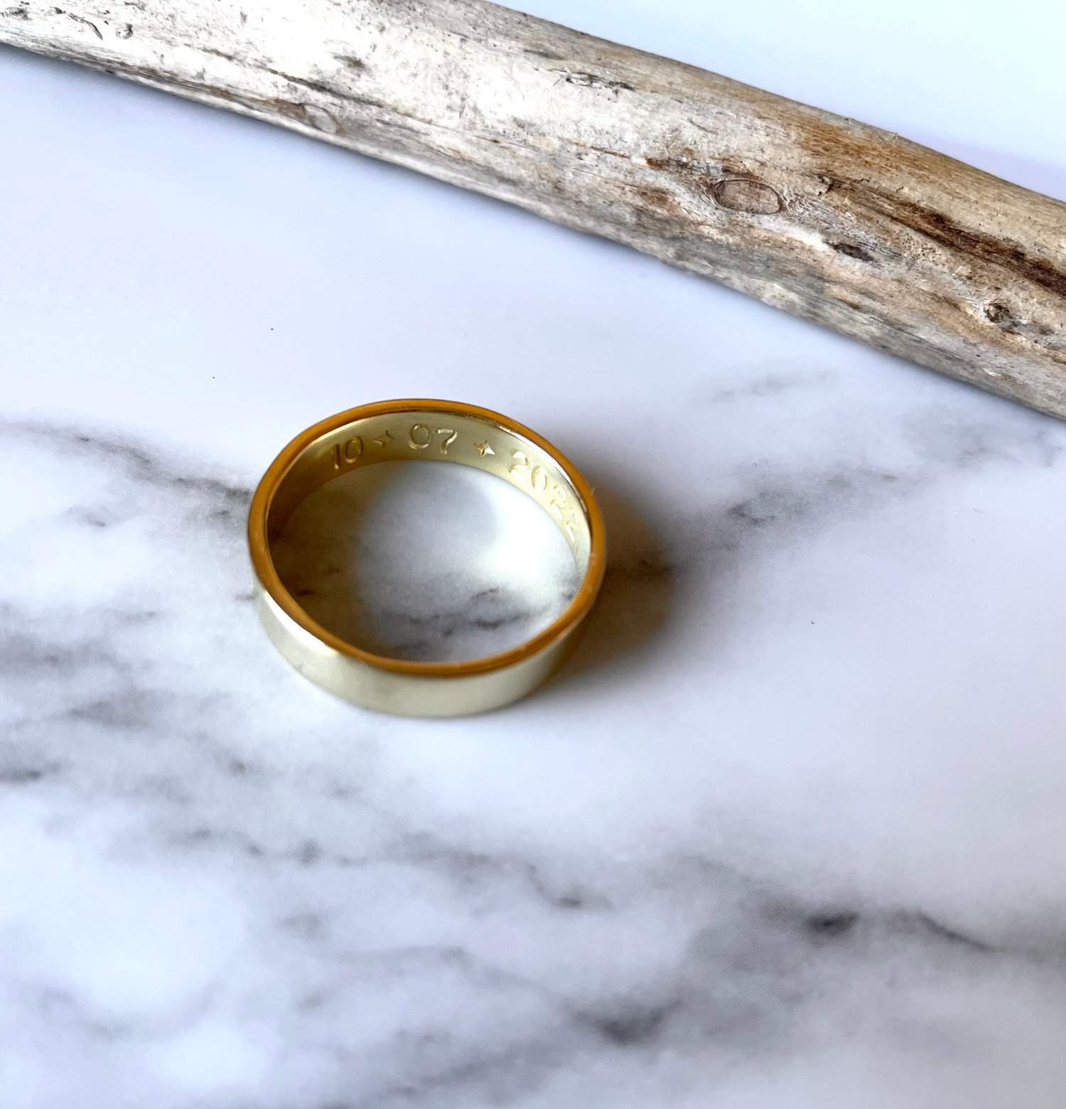 Image of Celestial 18ct Gold Wedding Ring Crescent Moon Stamp Detail. Cosmic Moon Gold Wedding Band Stamped