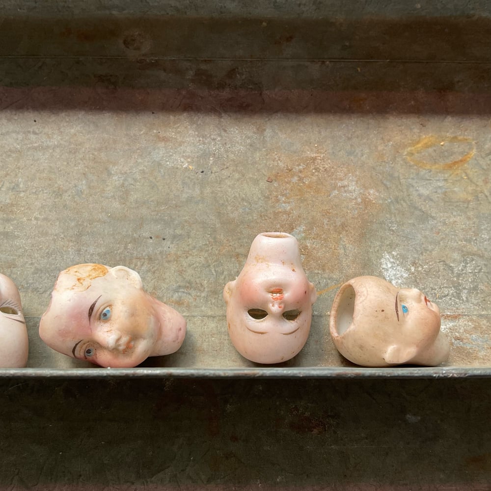 Image of Four Tiny Doll Heads