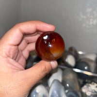 Image 2 of Carnelian x Orca Agate Sphere
