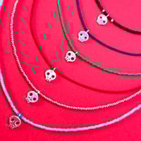 Image 1 of Dia de los Muertos tiny skulls necklaces