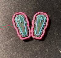 Teal and Pink Coffins