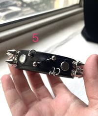 Image 4 of bite me and pierced leather cuffs