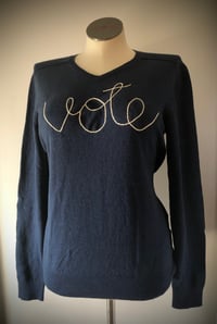 Upcycled & hand-embroidered “Vote” sweater