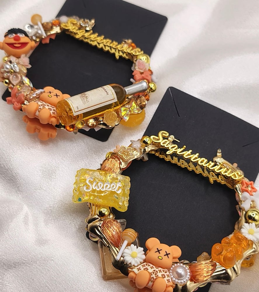 Image of zodiac sign junk earrings