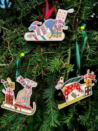 Image 1 of Pack of 3 Christmas decorations featuring hounds on sled, skis and snowboard 