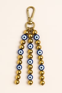 Image 1 of Gold Hematite & Evil Eye Protection Bag Charm – Luxury Spiritual Keychain