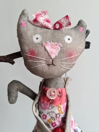 Image 1 of The red bow kitty. 