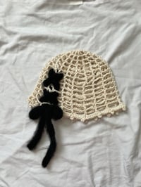 Image 1 of black lace up beanie 
