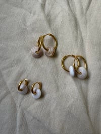 Image 1 of Puka huggie hoops