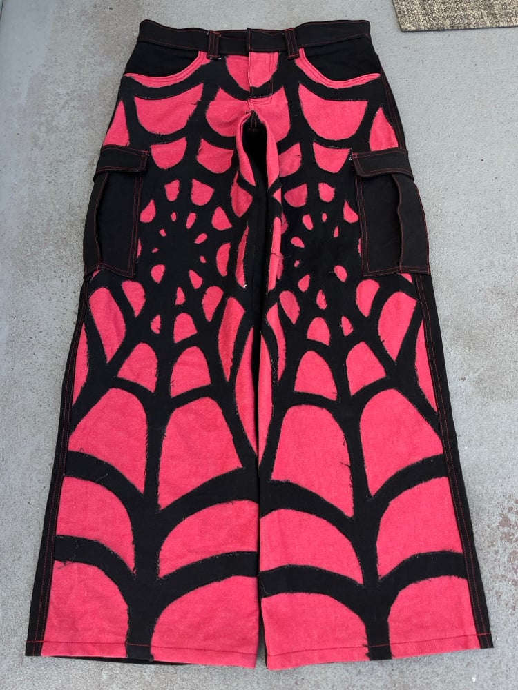Image of red/blk web jeans