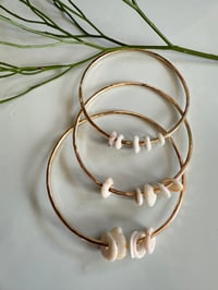 Puka shell bangle
