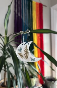 Image 1 of milky butterfly hoops