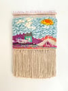 Little blue house in the Candy Mountains. Woven wall hanging.