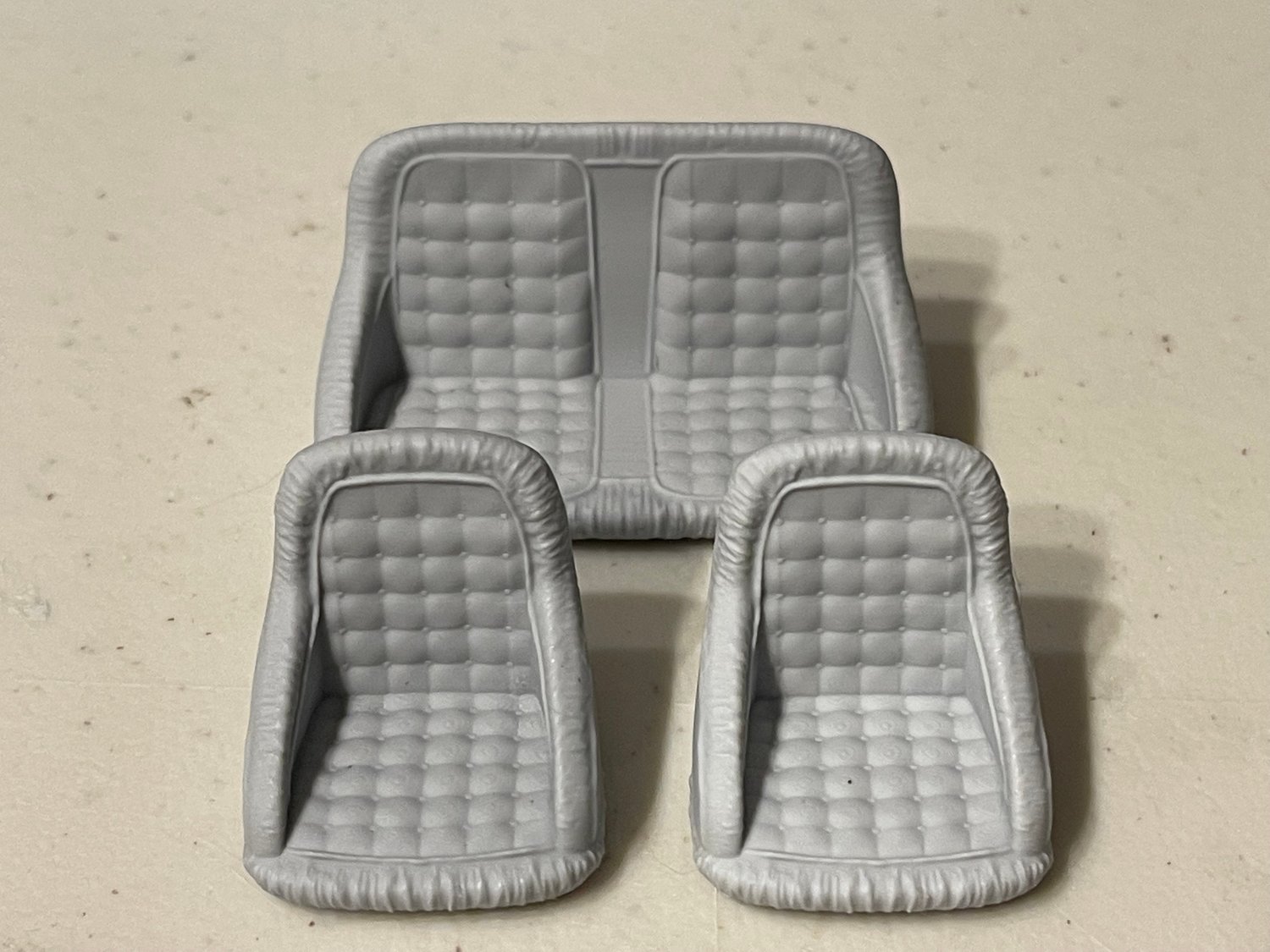 Lowrider or custom seats. Resin cast