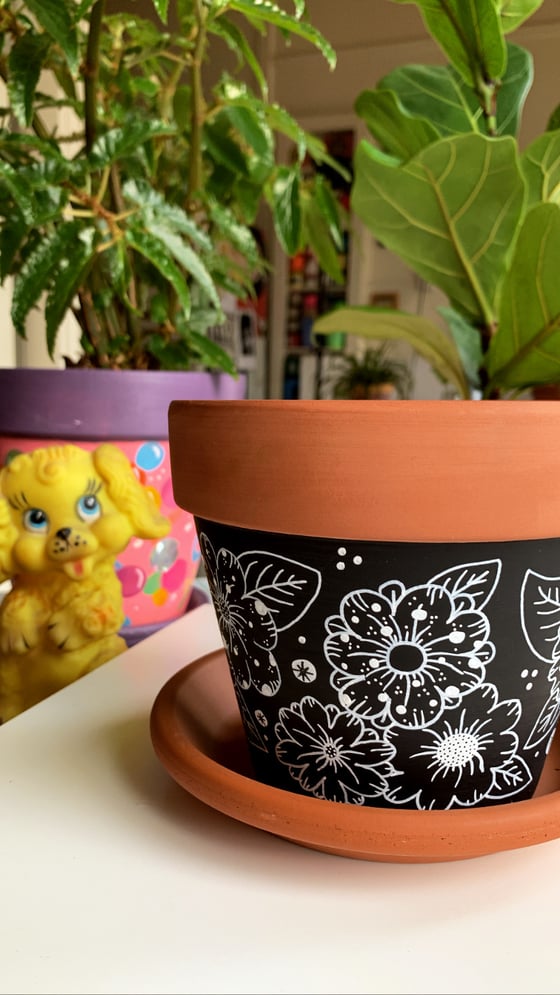 Image of "Black Flowers" terra cotta pot