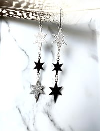 Image 2 of Handmade Silver Cosmic Triple Star Dangly Earrings. Celestial Silver Starry Earrings