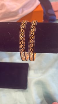 Image 2 of gold and black bangle 