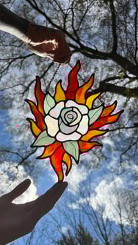 Image 1 of white rose in flames