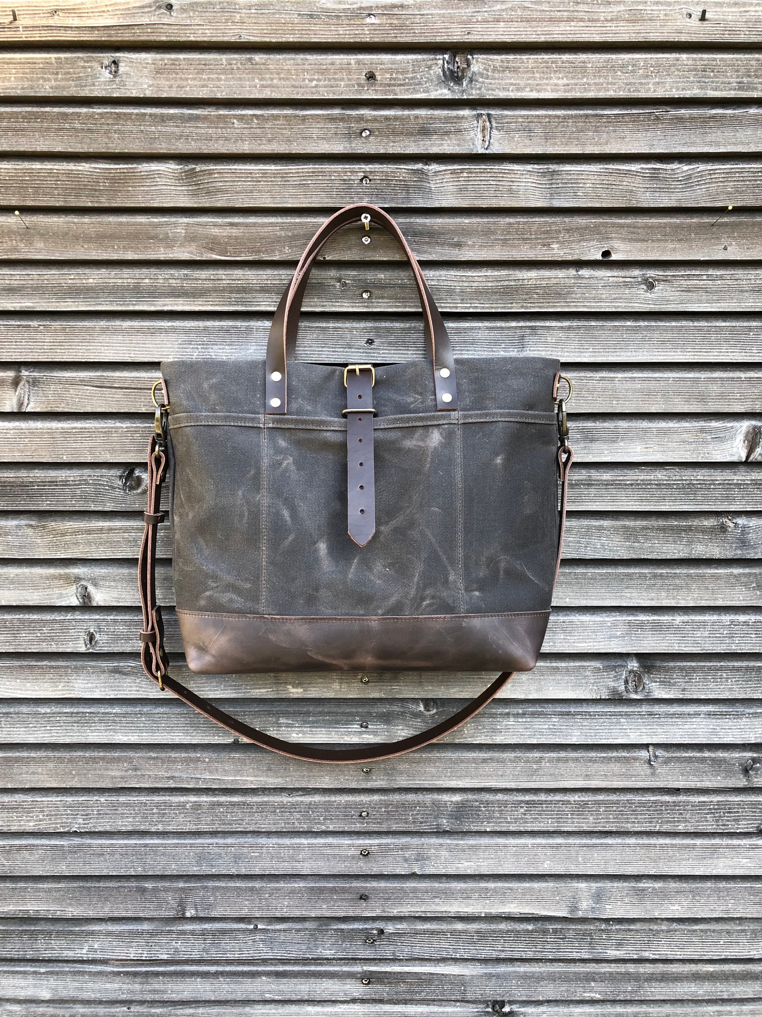 Image of Tote bag in grey brown waxed canvas with leather bottom and cross body strap