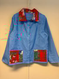 Image 1 of Blue shirt with flowers (m/l)