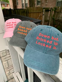 Image 1 of 'Down Bad. Bricked Up. Locked In' Hats