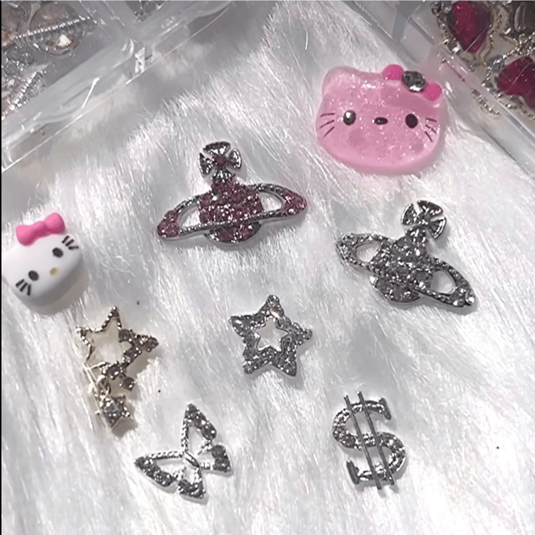 Hello kitty nails by Helena and hand made charms made by Xiomara